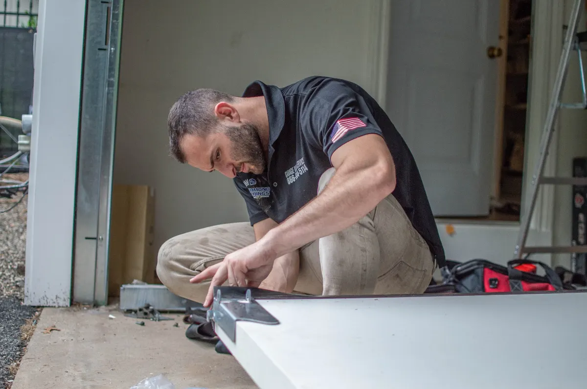 Smart Garage Doors technician Ben working on garage door installation